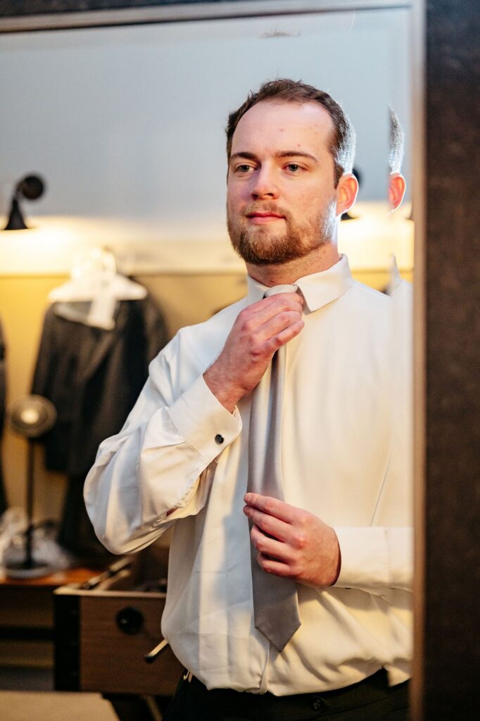 groom getting ready at Mission Theatre