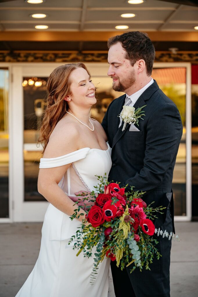 Couples photos outside of Mission Theatre