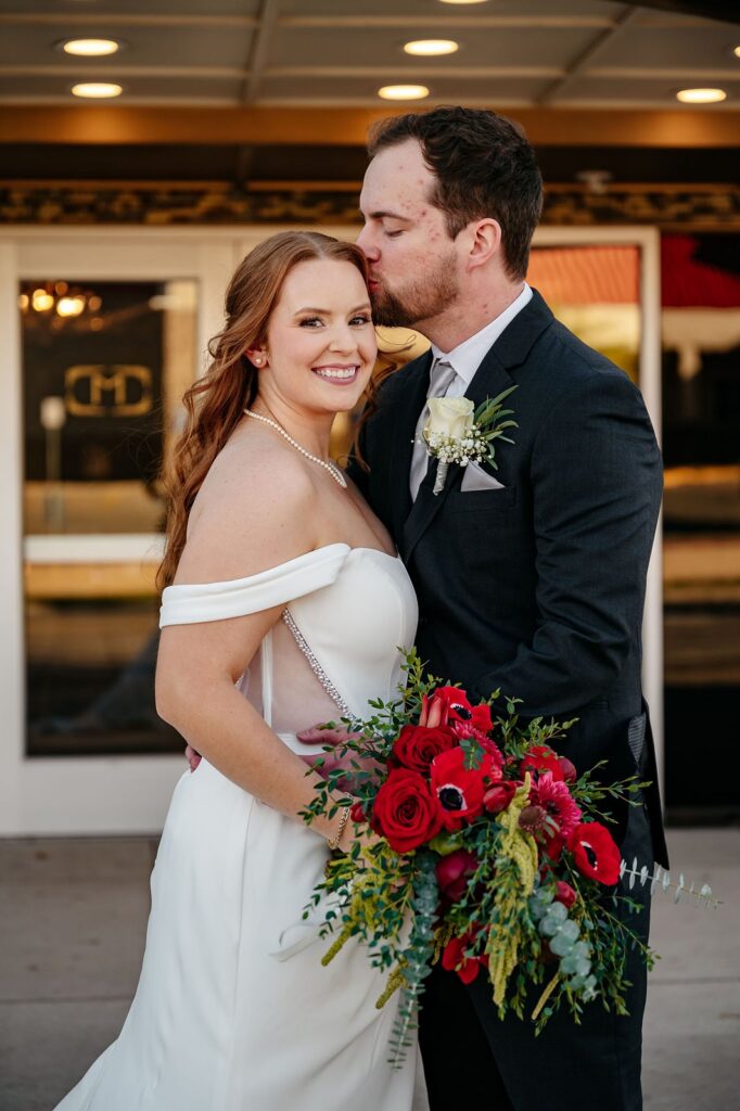 Couples photos outside of Mission Theatre